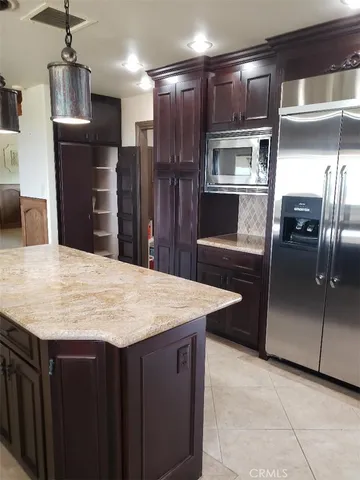a kitchen with a stove and a sink