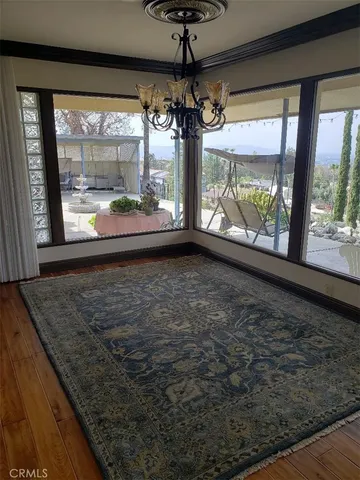 a living room with stainless steel appliances