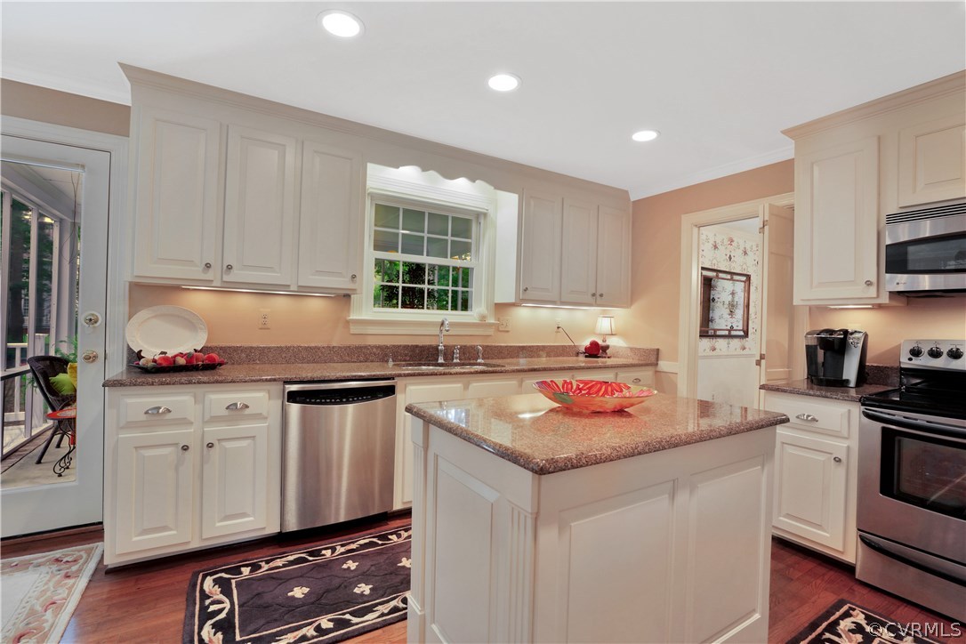 14301 Newgate Road Midlothian, VA 23113 - Photo 11 of 37 a kitchen with stainless steel appliances granite countertop a stove sink and cabinets