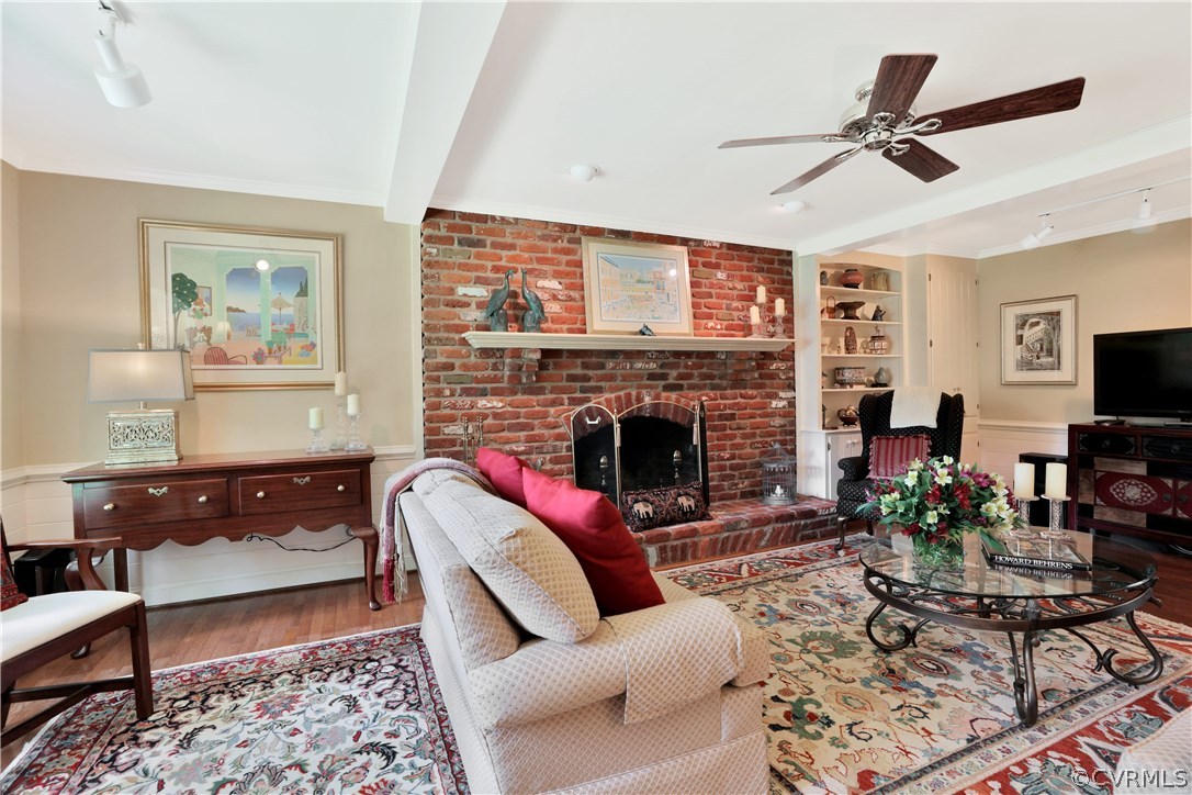 14301 Newgate Road Midlothian, VA 23113 - Photo 17 of 37 a living room with furniture a rug and a fireplace