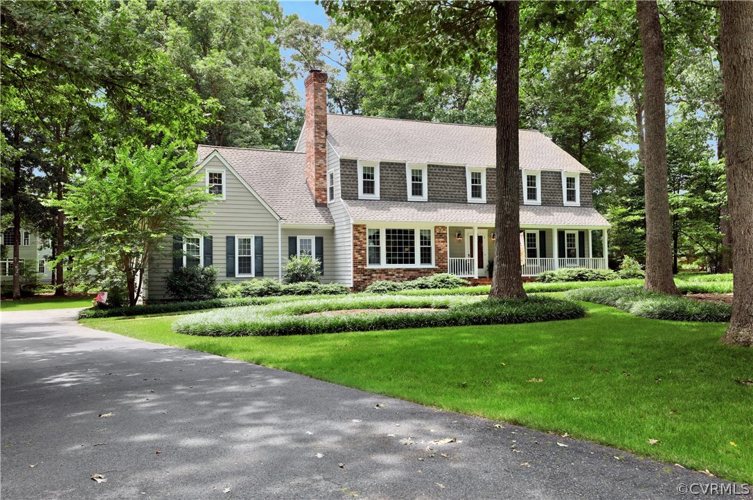 14301 Newgate Road Midlothian, VA 23113 - Photo 2 of 37 a front view of a house with a yard
