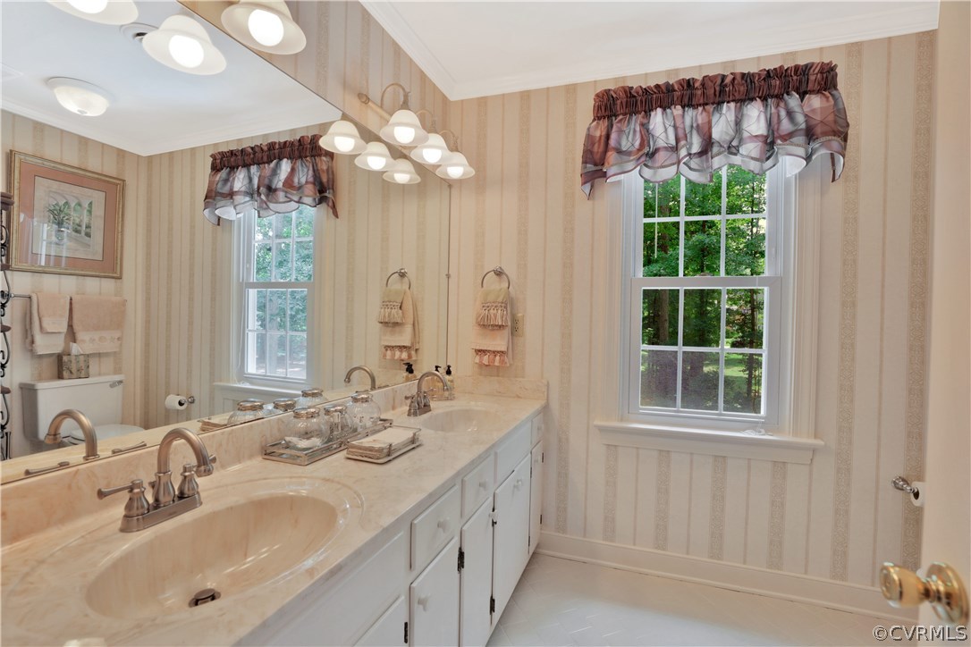 14301 Newgate Road Midlothian, VA 23113 - Photo 26 of 37 a bathroom with a double vanity sink and a mirror