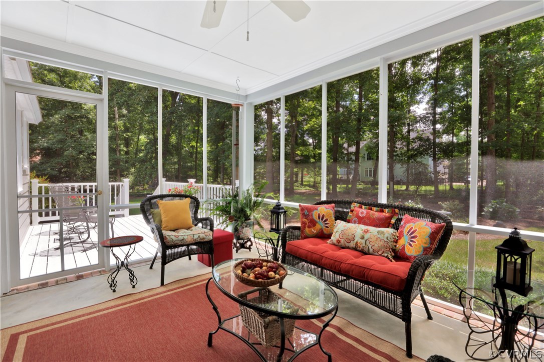 14301 Newgate Road Midlothian, VA 23113 - Photo 30 of 37 a living room with furniture and a floor to ceiling window