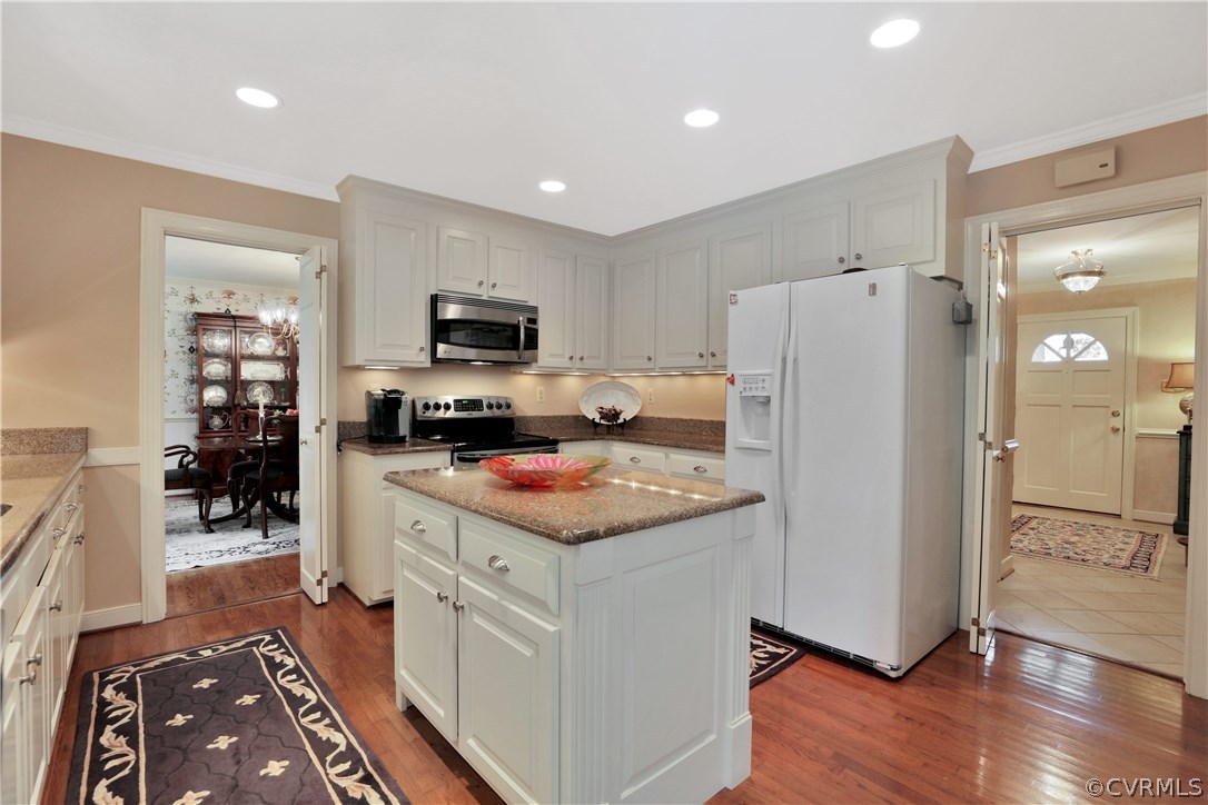 14301 Newgate Road Midlothian, VA 23113 - Photo 10 of 37 a kitchen with refrigerator and cabinets