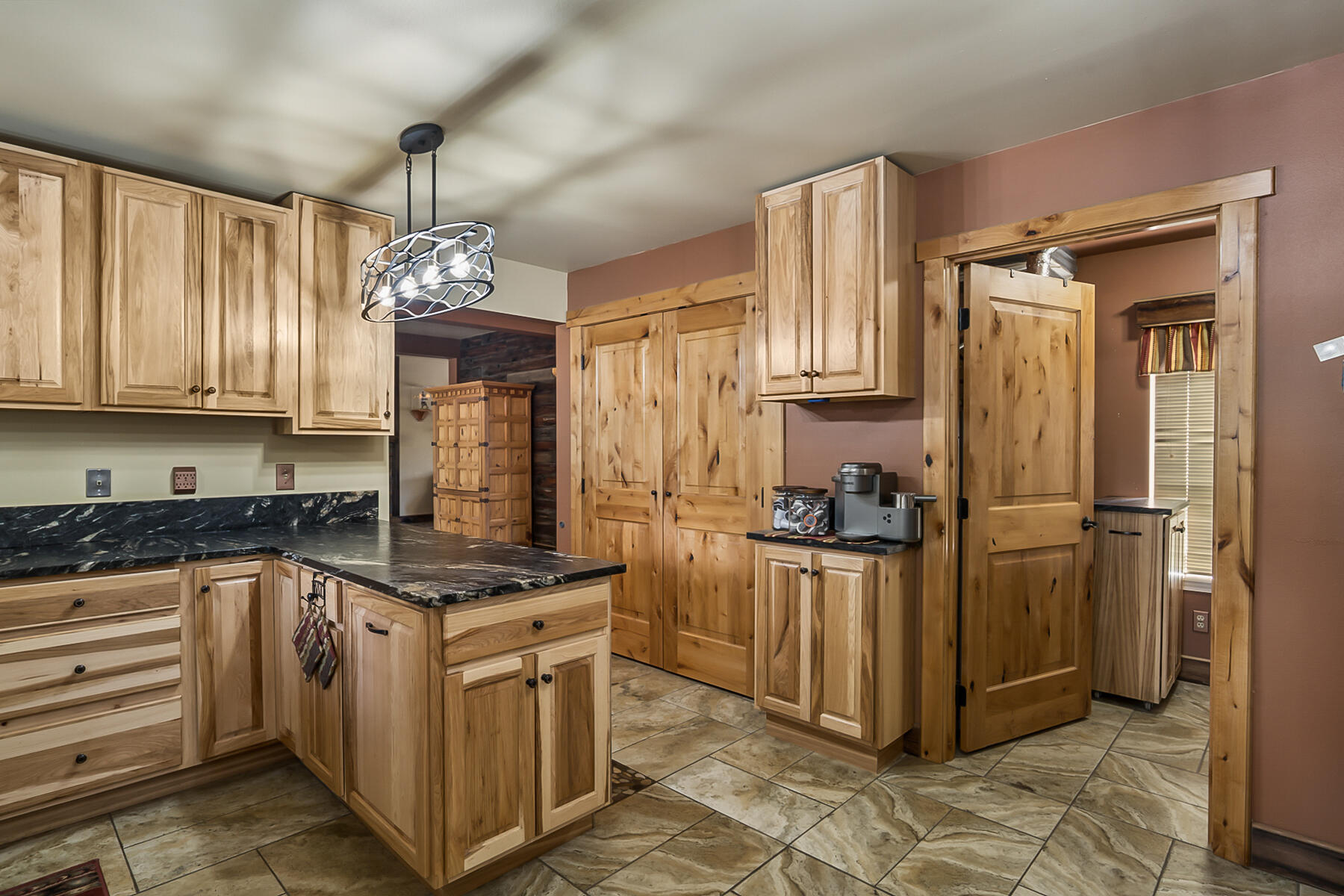 15730 Jackpine Road La Pine, OR 97739 - Photo 18 of 43 a kitchen with stainless steel appliances granite countertop a stove top oven a refrigerator and cabinets
