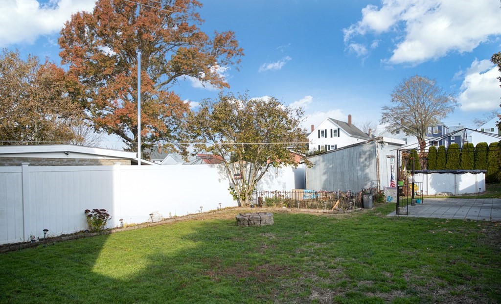 552 Palmer Street Fall River, MA 02721 - Photo 2 of 15 a backyard of a house with lots of green space