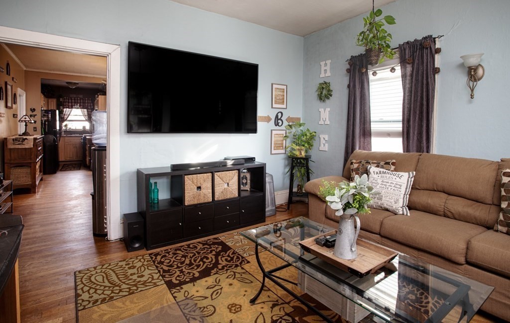 552 Palmer Street Fall River, MA 02721 - Photo 3 of 15 a living room with furniture and a flat screen tv
