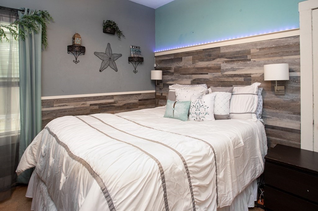 552 Palmer Street Fall River, MA 02721 - Photo 4 of 15 a bedroom with a bed and balcony