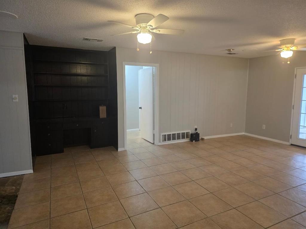Undisclosed Address Hurst, TX 76054 - Photo 4 of 29 BUILT IN BOOKCASE AND CEILING FAN