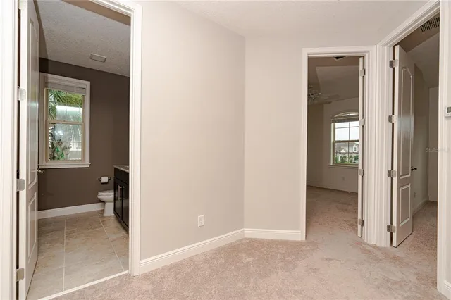 a view of a small space with wooden floor