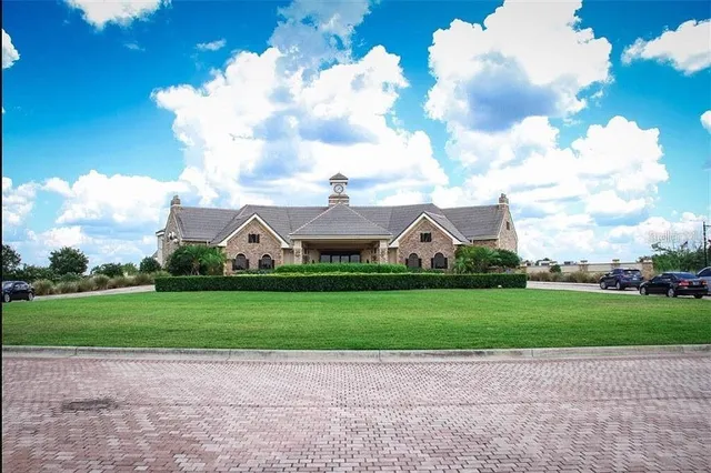 a view of a swimming pool with a yard