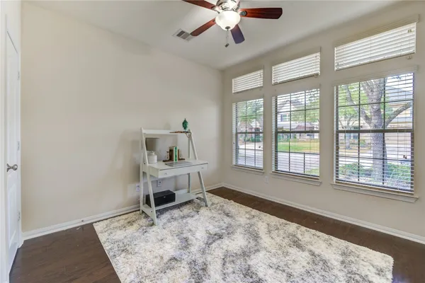 a kitchen with stainless steel appliances granite countertop a stove a sink and a refrigerator with wooden cabinets