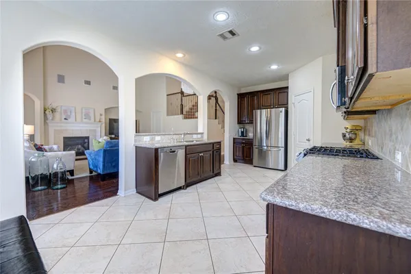 a living room with furniture fireplace and flat screen tv