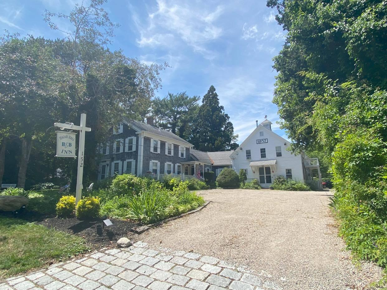 152 Whig Street Dennis, MA 02638 - Photo 1 of 35 a view of a street with a house in the background