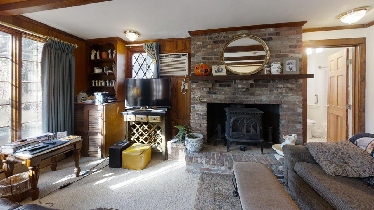 152 Whig Street Dennis, MA 02638 - Photo 11 of 35 a living room with furniture and a fireplace
