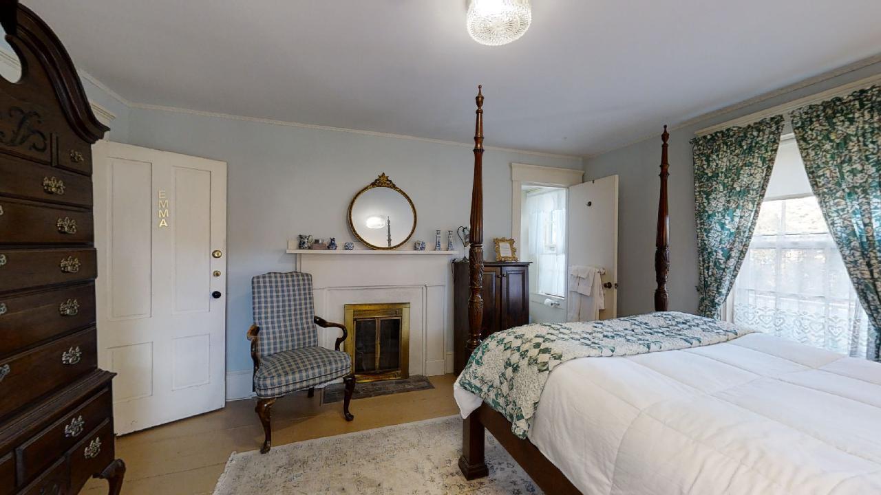 152 Whig Street Dennis, MA 02638 - Photo 14 of 35 a bedroom with a bed a mirror on dresser and a window