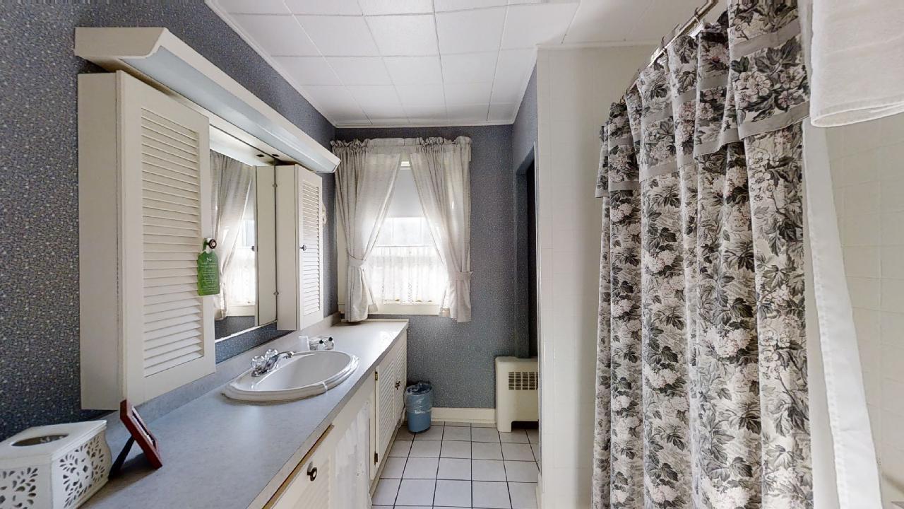 152 Whig Street Dennis, MA 02638 - Photo 16 of 35 a bathroom with a sink and a mirror