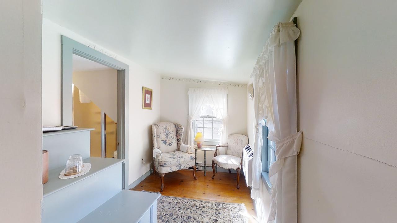 152 Whig Street Dennis, MA 02638 - Photo 21 of 35 a living room with furniture and a table