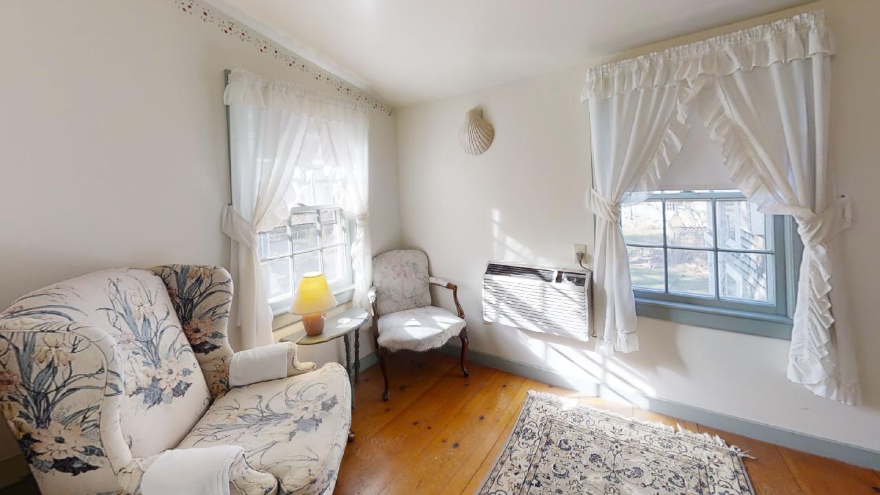 152 Whig Street Dennis, MA 02638 - Photo 25 of 35 a living room with furniture and a large window