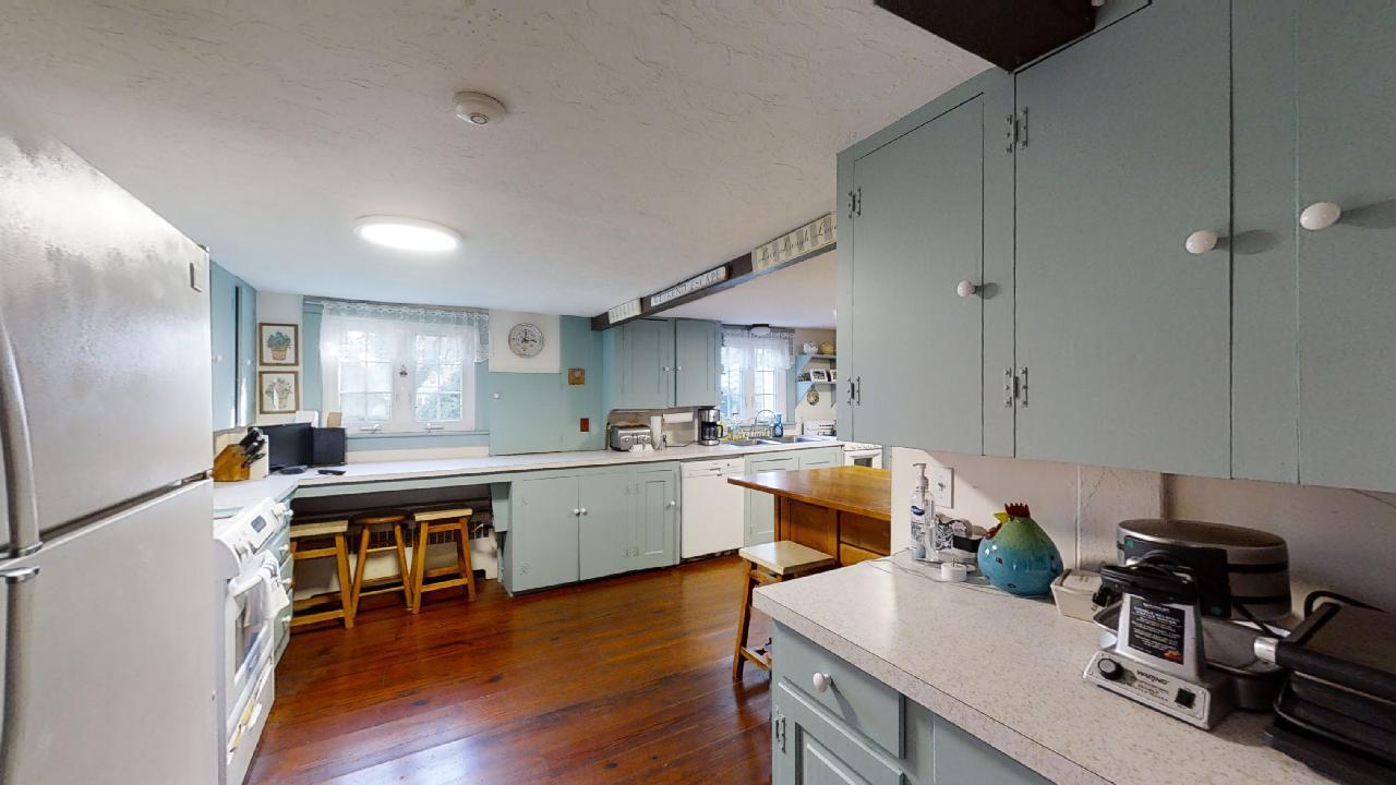 152 Whig Street Dennis, MA 02638 - Photo 9 of 35 a view of a kitchen and dining room