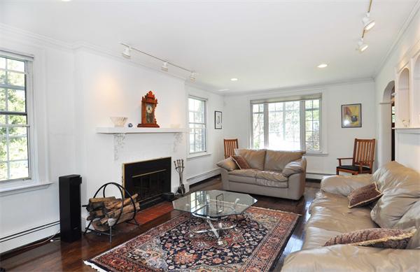 80 Arnold Road Newton, MA 02459 - Photo 4 of 11 a living room with furniture and a fireplace