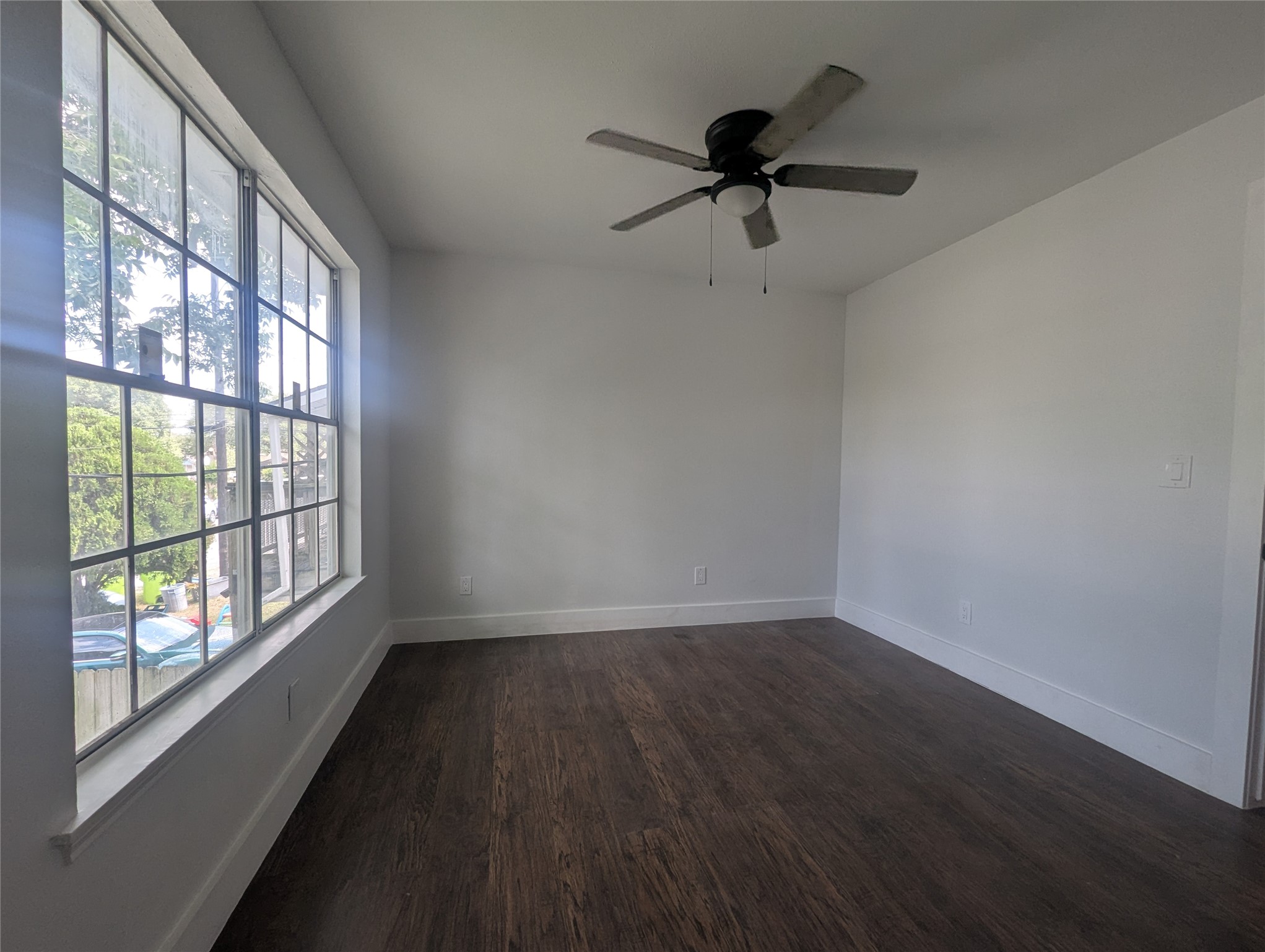 804 Ward Street Rosenberg, TX 77471 - Photo 7 of 9 a view of empty room with wooden floor and fan