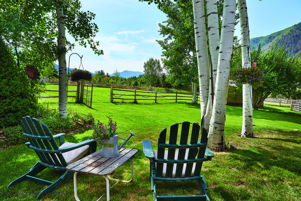 88 Holland Hills Road Basalt, CO 81621 - Photo 16 of 52 a view of a chairs and table in the patio