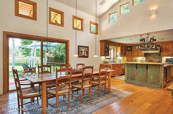 88 Holland Hills Road Basalt, CO 81621 - Photo 25 of 52 a dining room with furniture and wooden floor