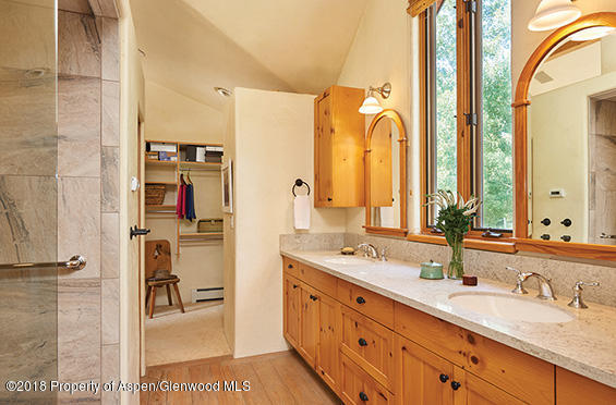 88 Holland Hills Road Basalt, CO 81621 - Photo 31 of 52 a spacious bathroom with a double vanity sink and a mirror