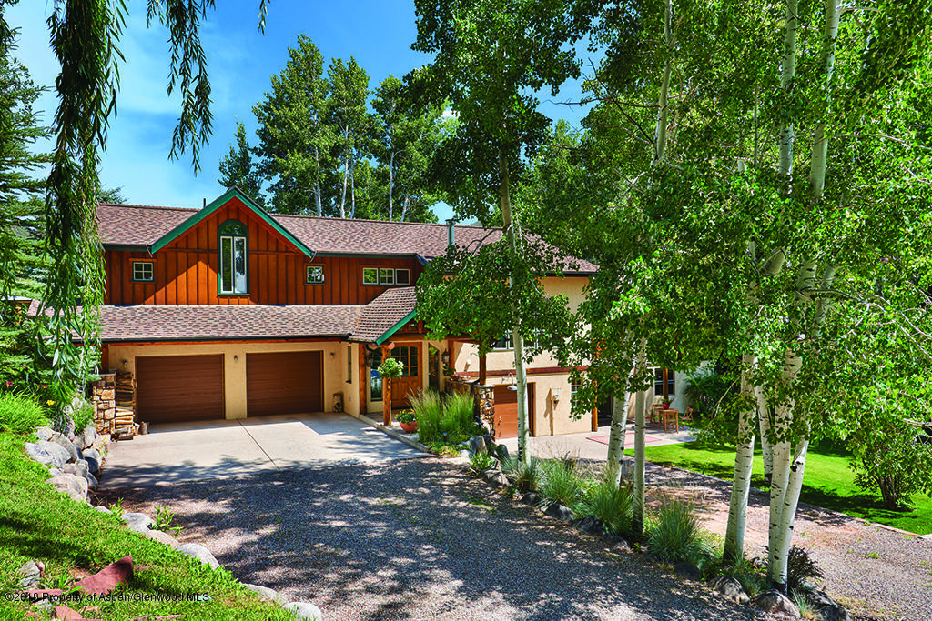 88 Holland Hills Road Basalt, CO 81621 - Photo 4 of 52 a front view of a house with a garden