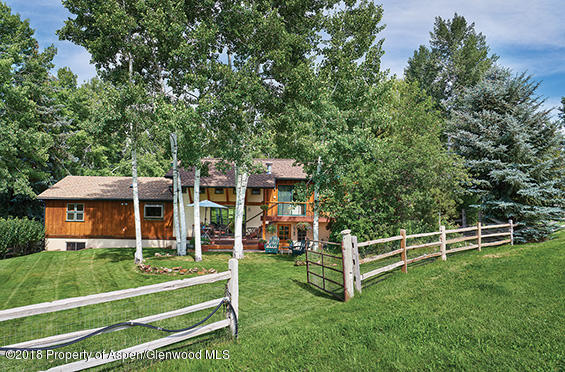 88 Holland Hills Road Basalt, CO 81621 - Photo 42 of 52 a view of house with a big yard and large trees