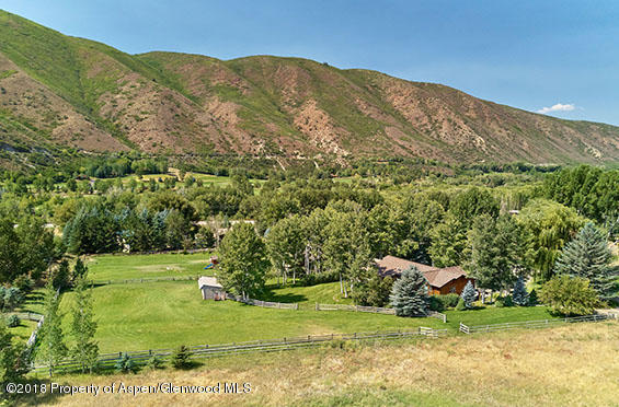 88 Holland Hills Road Basalt, CO 81621 - Photo 49 of 52 a view of a town with mountains in the background