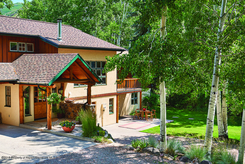88 Holland Hills Road Basalt, CO 81621 - Photo 5 of 52 a front view of a house with a yard