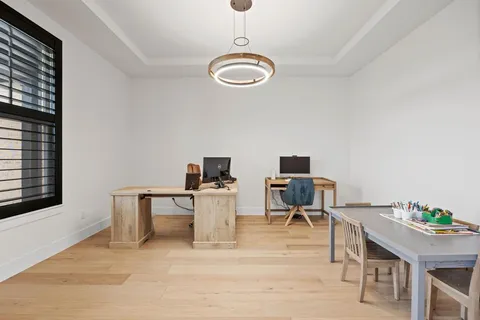 a bathroom with a sink toilet vanity and shower