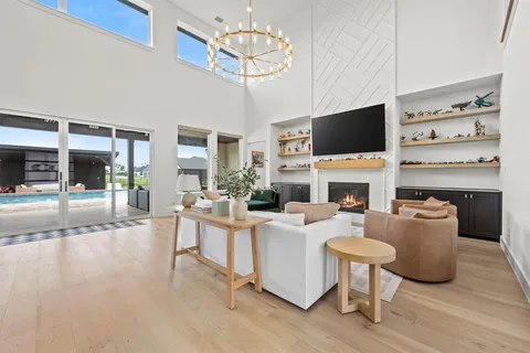 a living room with fireplace furniture and a flat screen tv