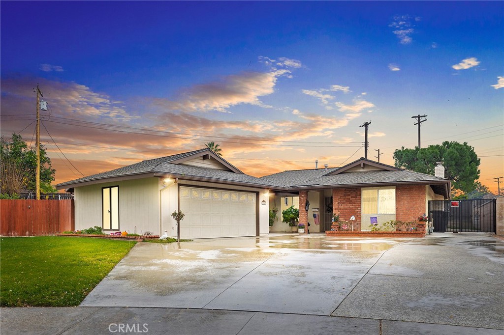 6290 Raleigh Street Riverside, CA 92506 - Photo 1 of 1 a front view of a house with a garden