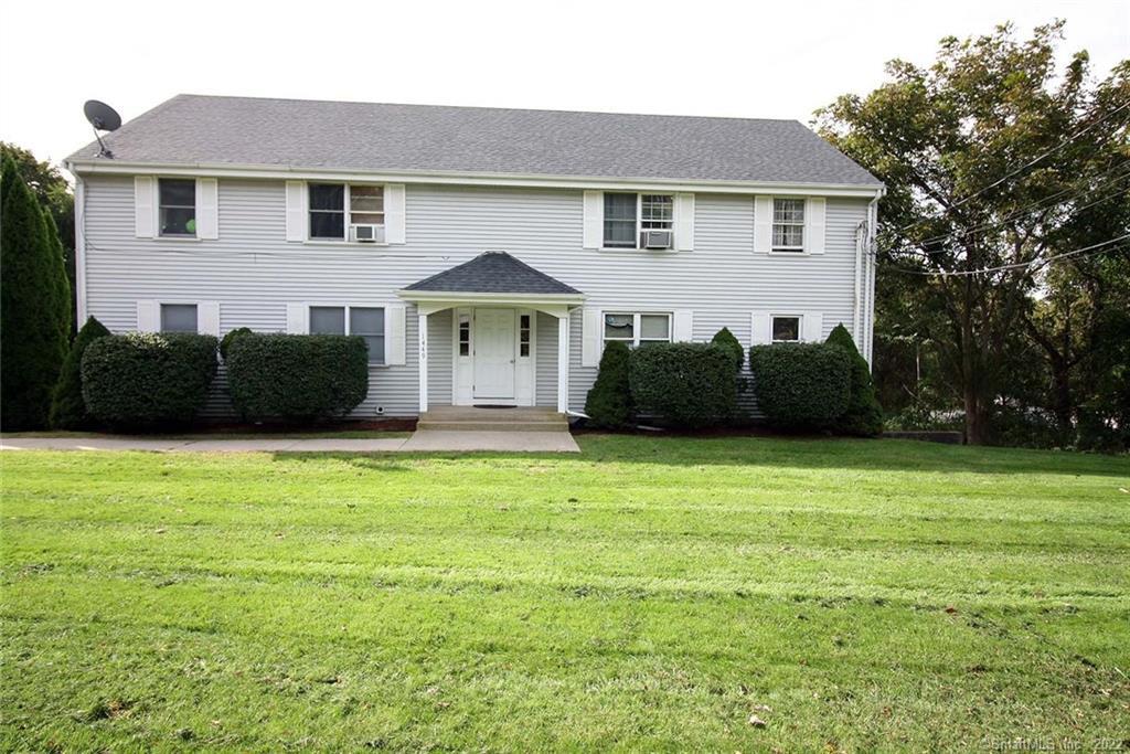 1449 Boston Post Road, Unit 21 Westbrook, CT 06498 - Photo 1 of 1 a front view of a house with a garden