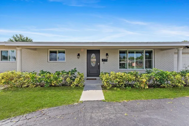 front view of house with a yard