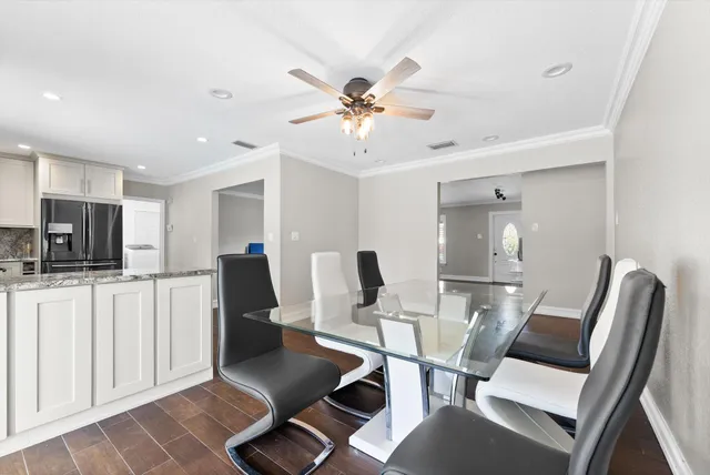 a view of a livingroom with furniture and a flat screen tv