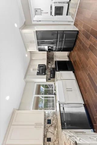 a washing machine sitting inside of a kitchen