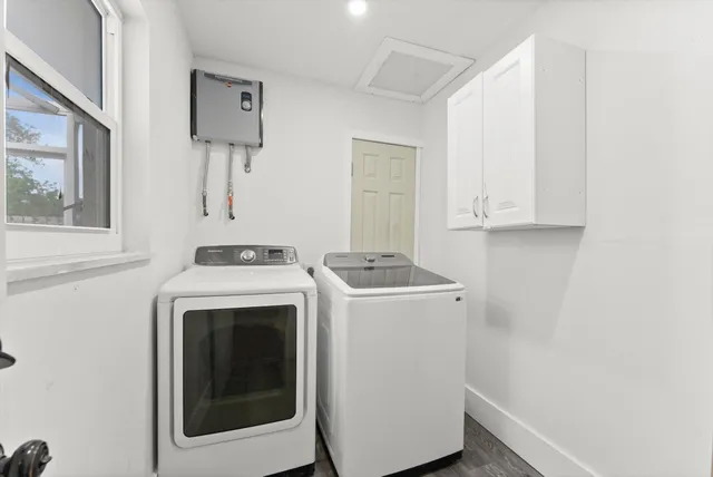 a utility room with dryer and washer