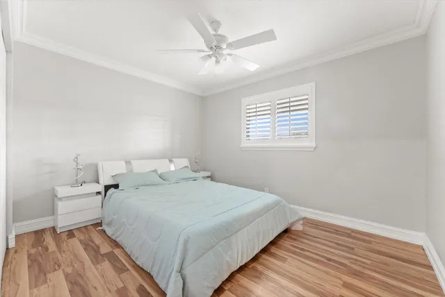 a bedroom with bed and window