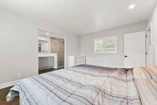 a bedroom with a bed and a dresser