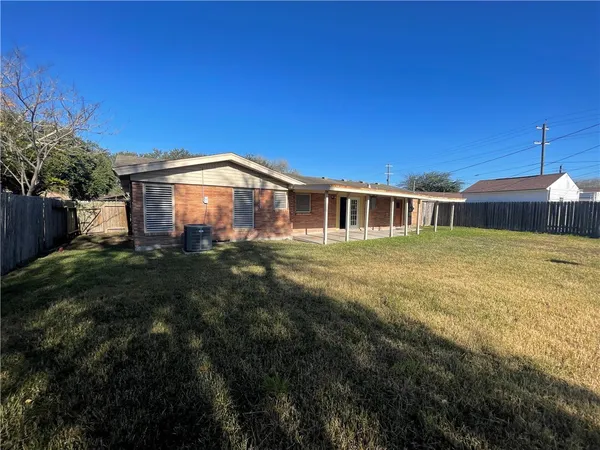 a view of a livingroom with a ceiling fan and window