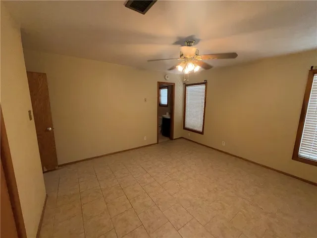 a bathroom with a glass door shower