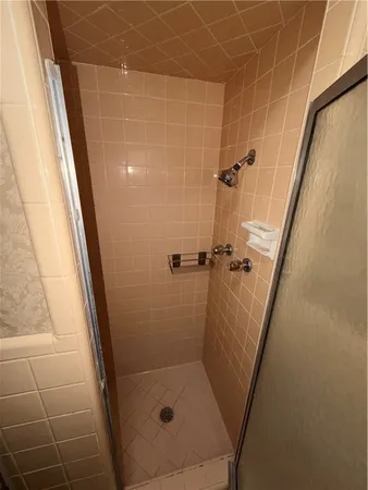 a bathroom with a sink toilet and mirror