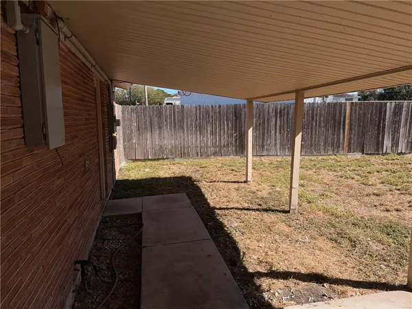 a view of backyard with cabin