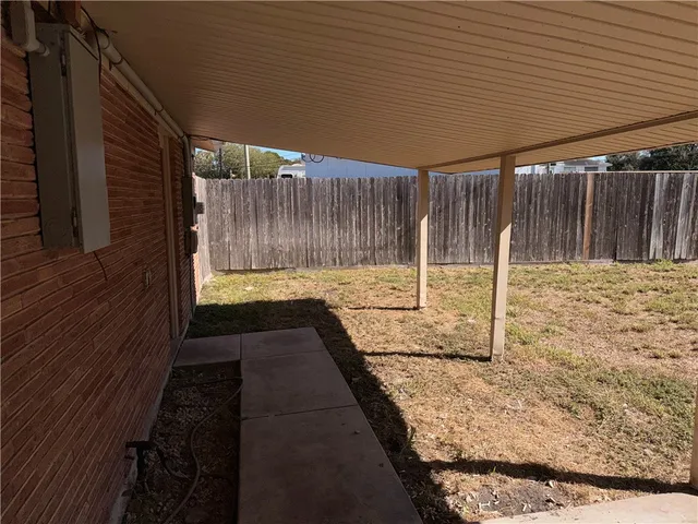 a view of backyard with cabin