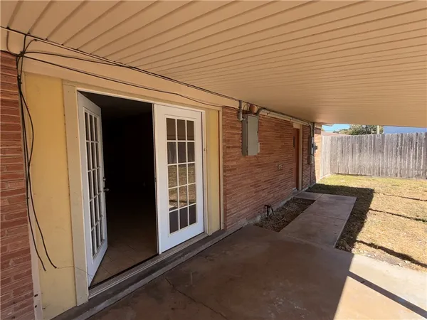 a view of a backyard with large trees