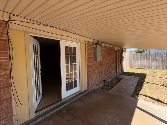 a view of a backyard with large trees